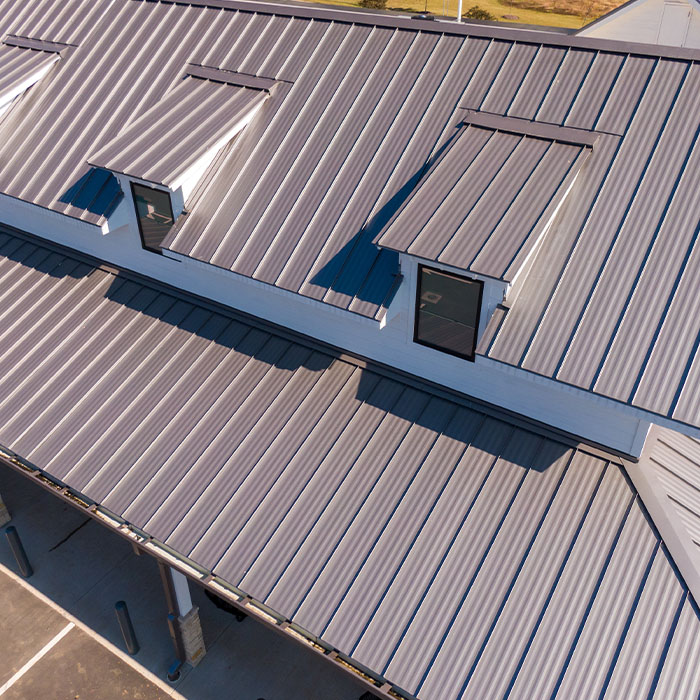 Buildings with sleek standing seam metal roofs