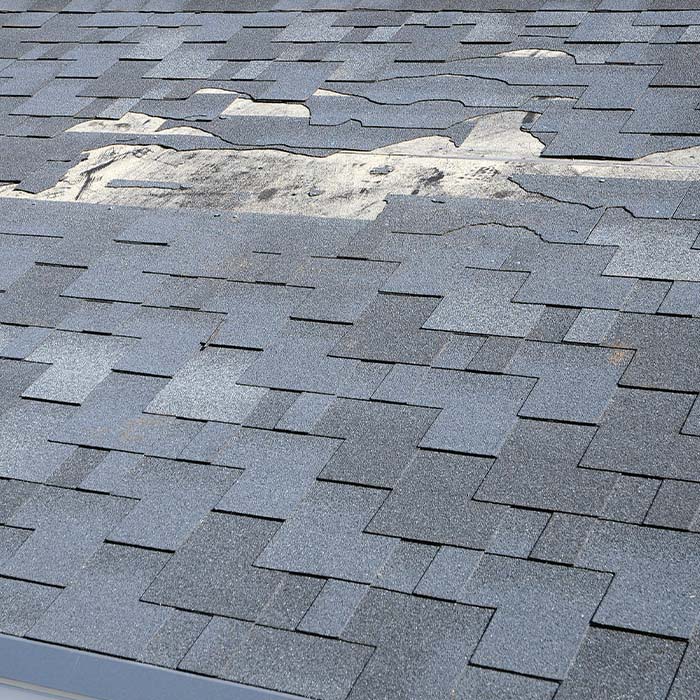 A close up view of shingles a roof damage